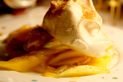 Meringue with salted caramel and mango close