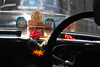 A dashboard altar in a Mumbai taxi