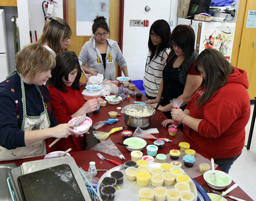 DHS Student learn to decorate cupcakes under the guidance of Mrs. Ambridge and Mrs. Adams.