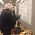 A student answering questions about her research