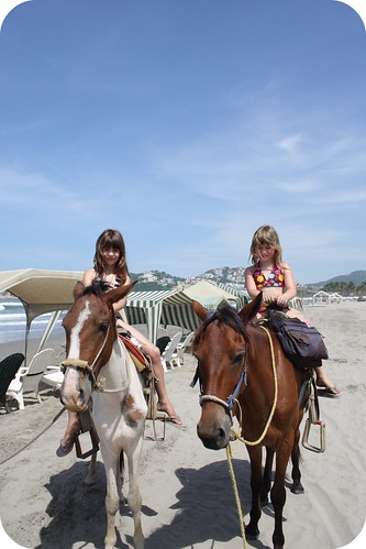 horseback riding on beach. little horseback riding on