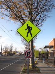 Will a bright yellow pedestrian warning sign get drivers attention? Photo by Wendi.