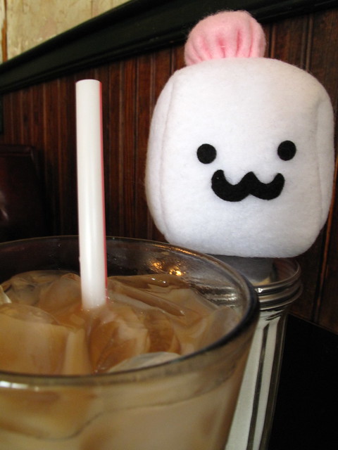 Tofu Baby has some iced coffee.