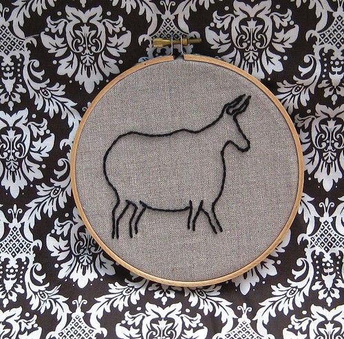 Cave-painting inspired stitched steer