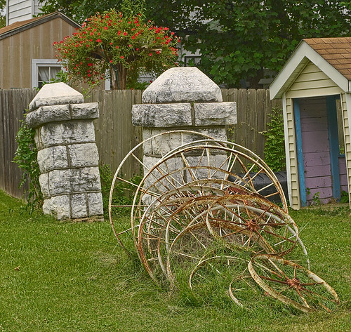 Wagon wheels and decorative stonework, in Kimmswick, Missouri, USA