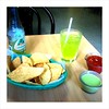Chips, salsa, tomatillo sauce, and lime soda