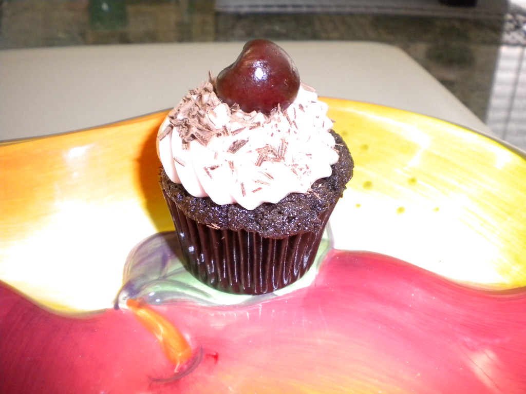 Cherry chocolate chip cupcake with cherry cream cheese frosting