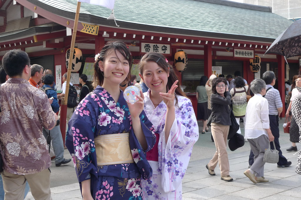 Two girls in Yukata at senso-ji temple during hozuki ichii