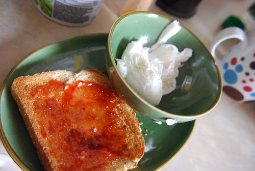 Poached eggs and toast with strawberry jam