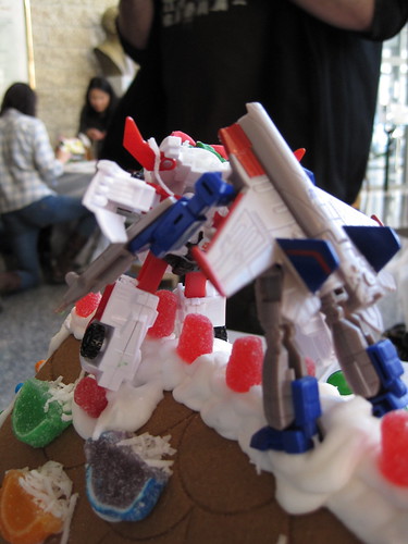 Transformers fight an epic battle atop the Unknown Studios gingerbread house