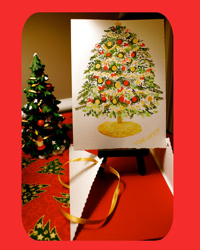 Christmas Tree Watercolor painting ready to display on an easel