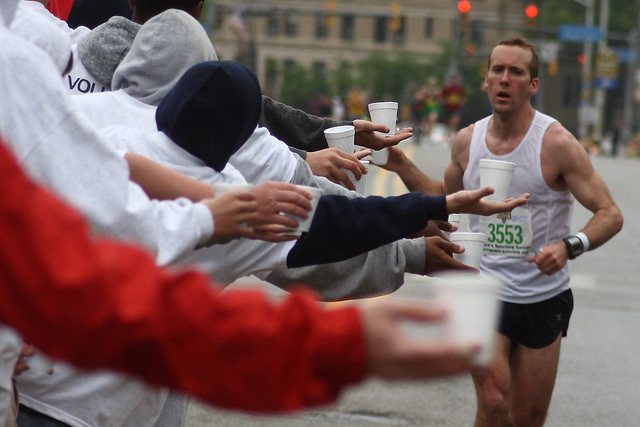 Marathon runner gets refreshment