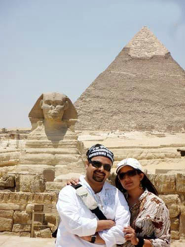 Kavya Madhavan and Nischal Chandran with Egyptian pyramid as background during their honeymoon