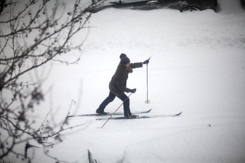 There is some guy skiing down my block!
