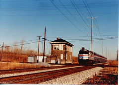 Westbound Amtrak train speeding through Argo Junction. Summit Illinois. December 1990.
