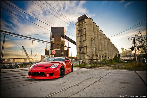 Nissan 350z Car n front of some industrial buildings in downtown Chicago