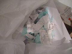 scraps of fabric and paper from foiled attempts