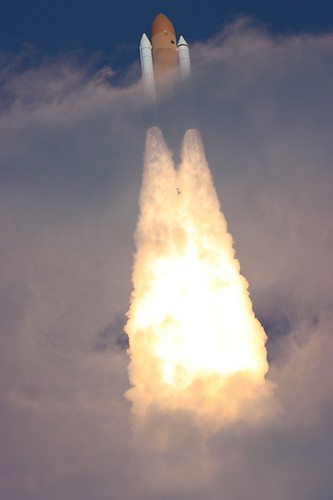 STS-129 Atlantis punching through clouds en route to the International Space Station