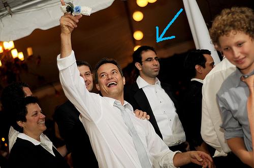 My cousin caught the garter. Eytan, in the background, looks totally bummed about it. 