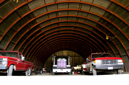 The grain truck and pick-up about to leave their winter home in the shed.