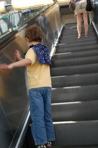 superhero uses escalator