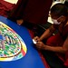 Sand Mandala at the Newark Museum - new use for a credit card!