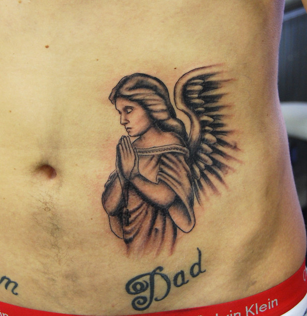 praying angel tattoo. Tattooed by Johnny at;. The Tattoo Studio