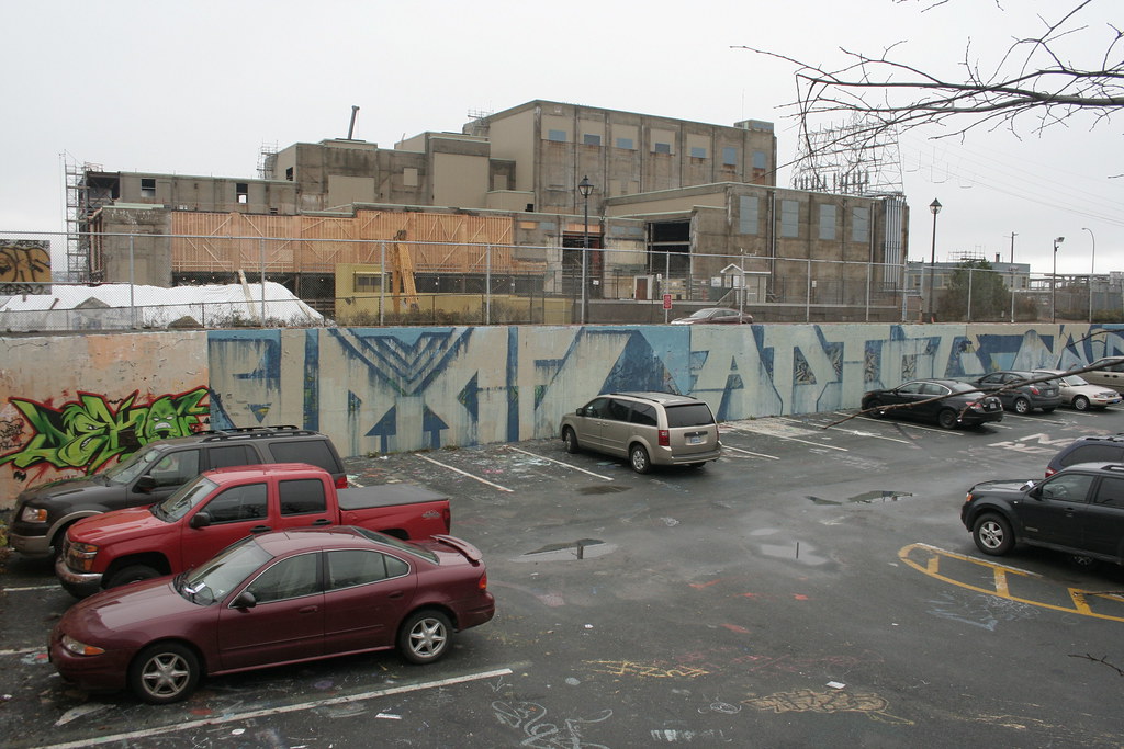 The Pit: parking lot and former legal wall. NSP offices under construction in the background.