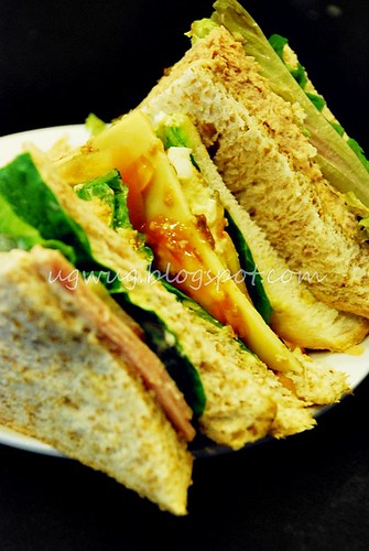 Chicken slice, cheese and tuna sandwich