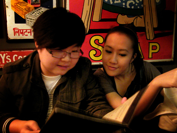 Rachel and Diana looking through the menu, deciding on what to order