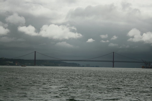 Lisbon Day 5 52 Ponte 25 de Abril and gathering rain clouds from boat