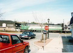 Westbound Burlington Northern / early Metra commuter local. Hindsdale Illinois. October 1989.