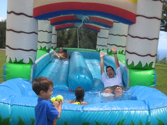 Daddy coming down the slip and slide