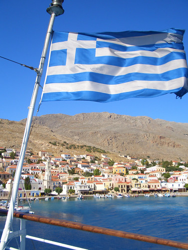 The Greek Flag in front of the Isle of Chalki