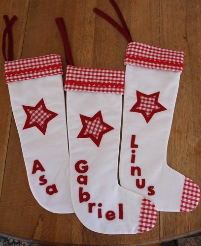 3 red and white Christmas stockings