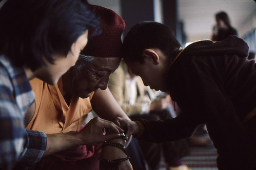 Tibetan sign of affection of head touching, looking at the time, HH Dilgo Khyentse Rinpoche, Rabjam Rinpoche, Dhungsey Ani Sakya, during Rinpoche's visit to the royal Tibetan Sakya family and Dharma Center, 1976 SeaTac Airport, Seattle,  Washington, by Wonderlane