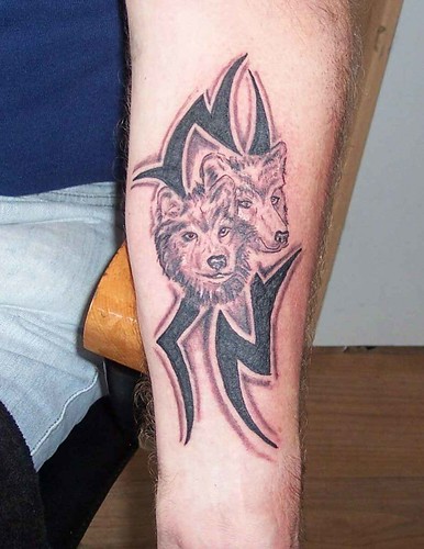 shaded tribal with wolfs Photo by Classic Ink Tattoo Studio