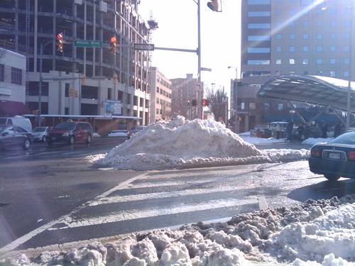 Plowed snowbank blocking pedestrian crossing in Clarendon