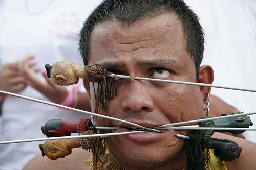 Man with pierced face at Kathu shrine, Phuket