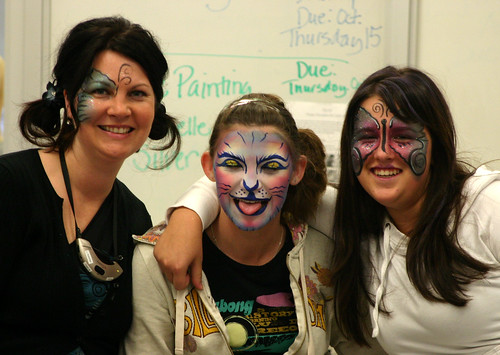Michelle Silver, Mackenzie Cameron and Megan Nault model the face painting done by Michelle.
