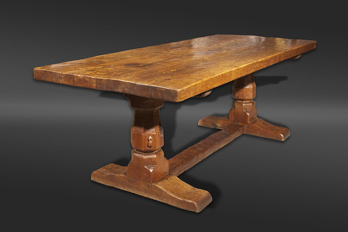 An oak refectory table by Robert Thompson of Kilburn, better known as The Mouseman