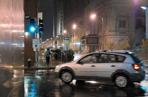 Downtown Saint Louis, Missouri, USA - turning car at night in the rain