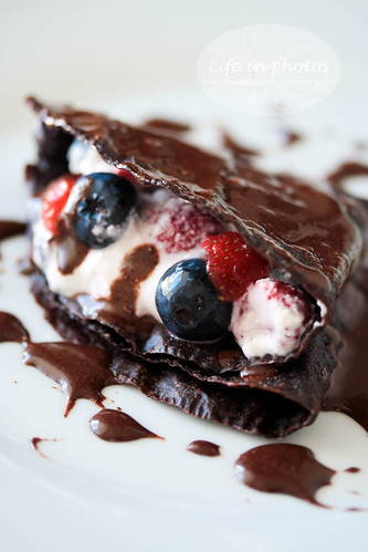Raw vegan cocoa crepes with sour cream and berries