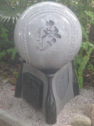 A baseball-themed statue housed within the shrine.