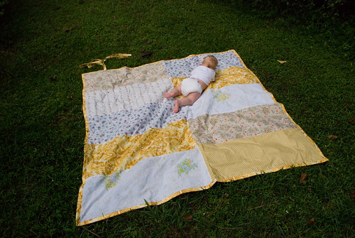 baby on beach blanket to go
