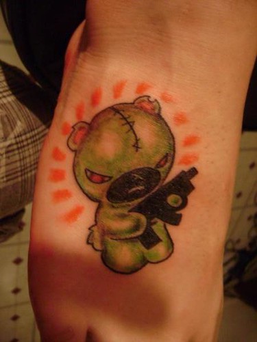 teddybear with gun tattoo. Justin at Kats Like Us Tattoos