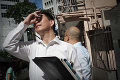 People watch the solar eclipse in Hong Kong