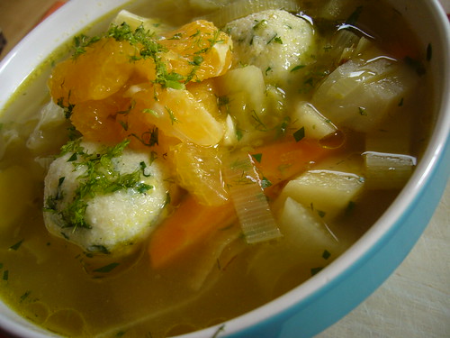 veggie soup with orange slices.