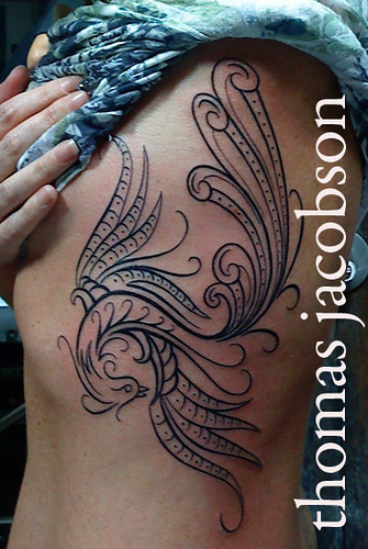 henna phoenix tattoo on ribs done by thomas jacobson bad dog tattoo orlando