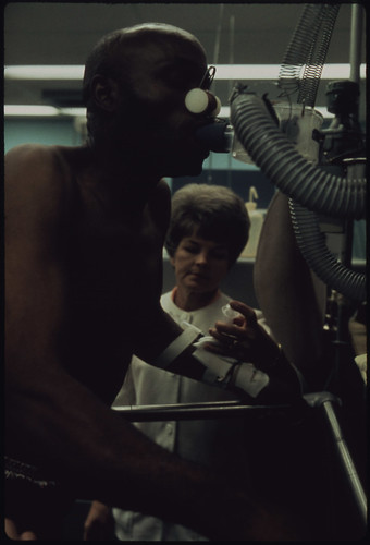 Tony Murphy Has His Lung Capacity Tested While Walking on a Treadmill at the Black Lung Laboratory at the Appalachian Regional Hospital in Beckley, West Virginia 06/1974 by The U.S. National Archives